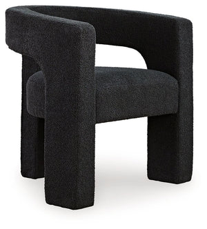 With its sculptural silhouette and barrel-back design, this accent chair exudes runway-inspired style. Peek-a-boo styling and decadent boucle upholstery combine both fashion and comfort seamlessly. Who says cutouts are just for your wardrobe?<br><br><b>Ad