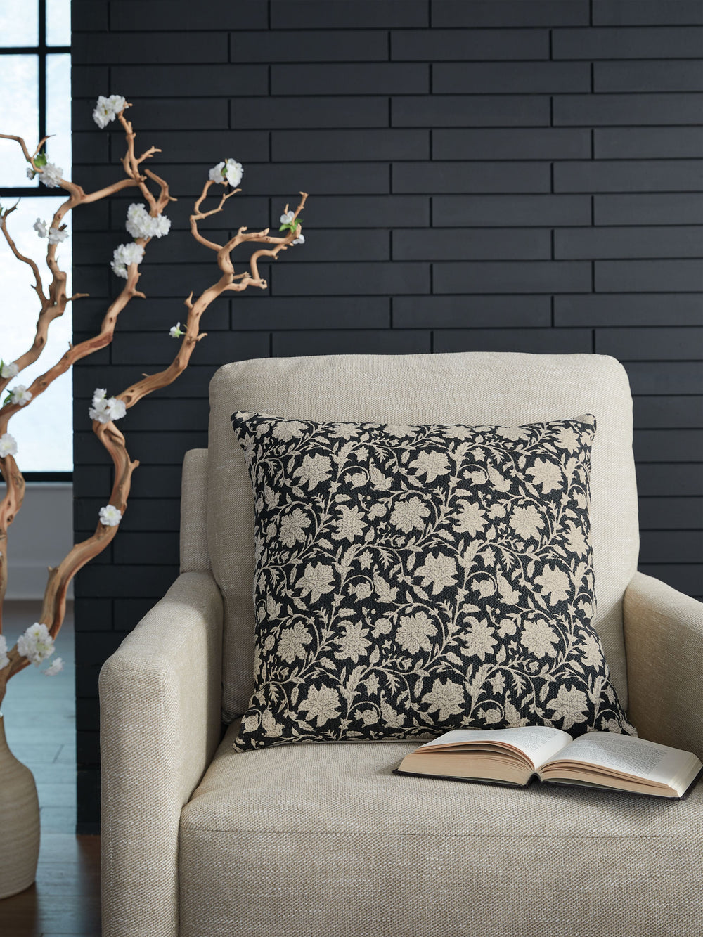 Let casual, charming style blossom. With hues of black, ivory and gray coming together in a simply chic floral design, this accent pillow is an eye-catching addition to your sofa or bed. What a chic way to bring a pop of pattern to neutral spaces.<br/><br