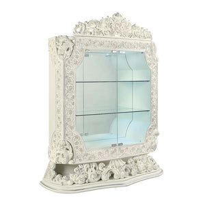 Add to your dining area a unique and alluring element with the Adara curio cabinet. The embellished design provides a captivating piece that is anything but ordinary. This curio cabinet features gorgeous scroll-shaped carvings and a scroll-shaped base. A 