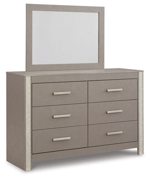 Love sleek and bold contemporary style? Drink in the beauty of this dresser with mirror. Its eye-catching details include glam glitter accents and the look of leather grain with a subtle gray finish. Large-scale linear handles, in a sophisticated champagn