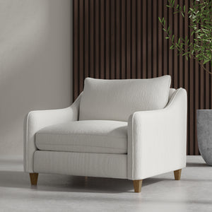  our Chair and a Half provides the perfect combination of comfort and style. The wood feet in a natural finish add a distinctive touch and lend a modern vibe to the design. Exquisitely tailored