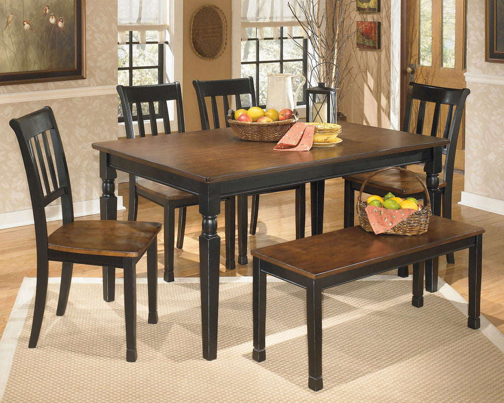 Made with select veneers and hardwood solids in a two-tone finish. Table tops and chair seats are finished in a burnished brown color. The chair frames and table bases are finished in cottage black paint. Glued and screwed corner block construction. <h4><