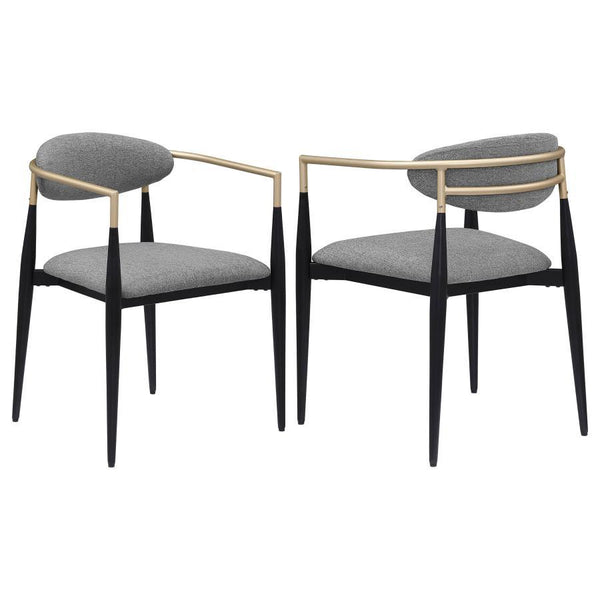 Refresh your dining table with the modern glam flair of a set of two armchairs. Perfect for family and friends, the chair offers impeccable comfort with a padded seat and an oval-shaped backrest with a gentle curvature for excellent support. Its metal fra