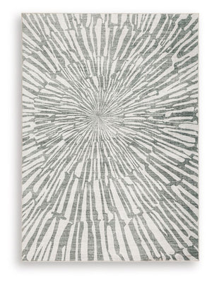This rug takes traditional design motifs and brings them into the present. Outfitted with deliciously soft faux fur and a chic sunburst design in shades of gray and white, it-'s an apt addition to contemporary interiors. Further suiting your modern lifest