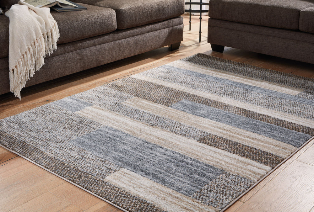 Casually chic in brown, cream and gray, this rug invites warm, welcoming vibes into your space. Its neutral hues expertly pair with a variety of aesthetics, whether your home is minimalist or filled with vibrant pops of color. And the rug-'s timeless stri