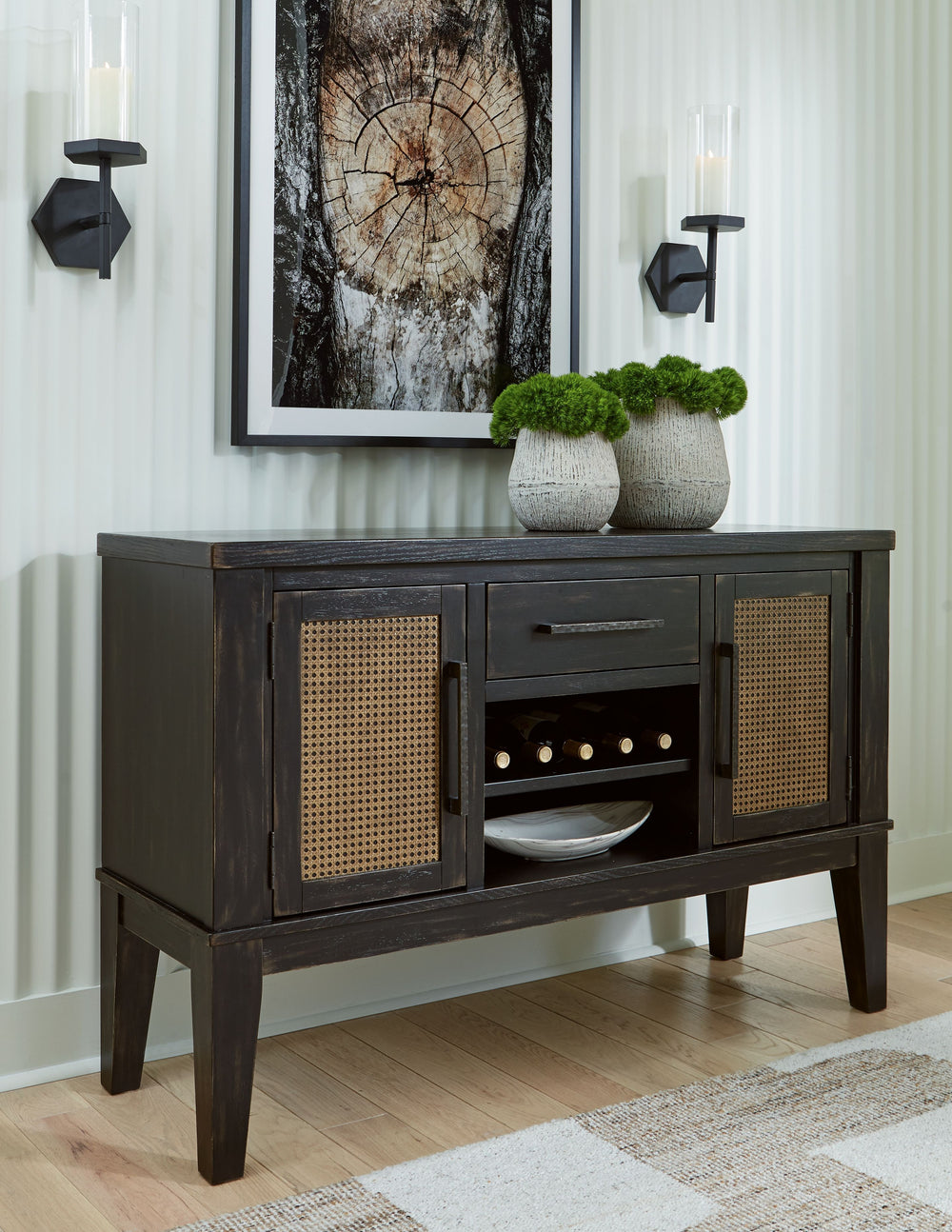 This dining server brings a rustic vibe to urban contemporary design. Itâ€™s a modern approach to natural beauty, with faux cane accents incorporating eye-catching texture. Chic storage is made possible with a reversible wine rack shelf, a drawer and cabi