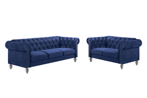 The New Classic Emma Chesterfield Velvet 2-Piece Sofa and Loveseat Set offers a soft and elegant seating solution for your living space. The 100% polyester velvet fabric provides cozy and indulgent seating, while the tufted backs and arms, adorned with gl