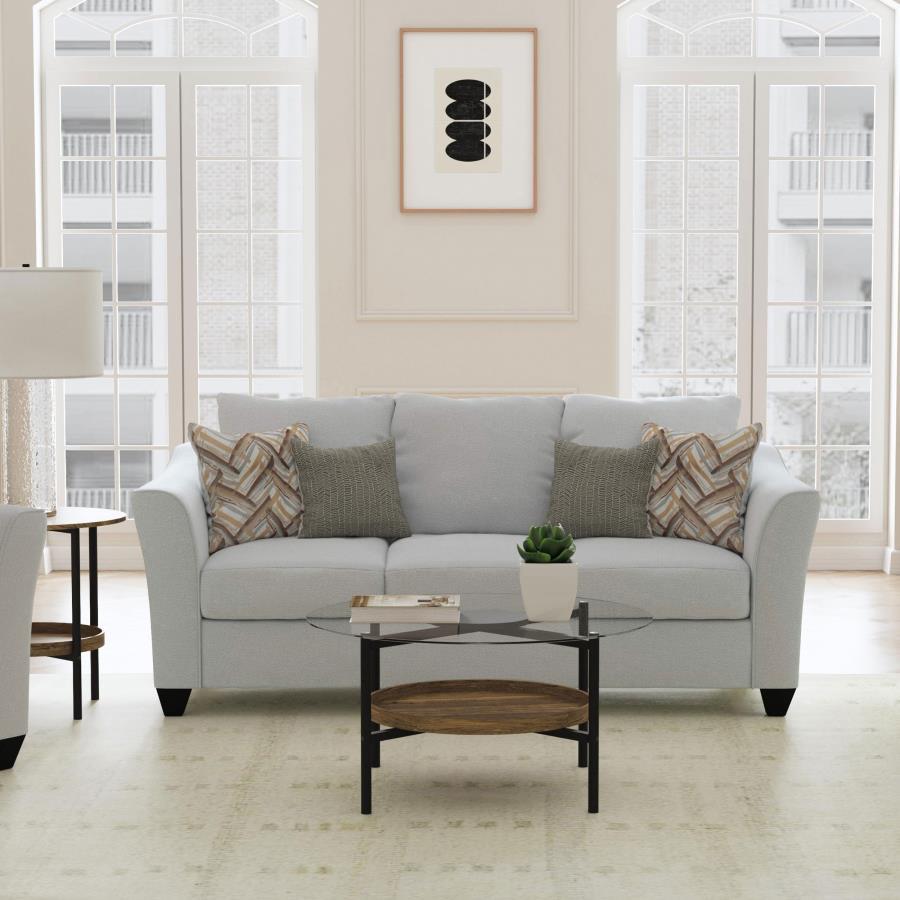 Inviting gray mist upholstery creates a rich, refined look and feel for a modern sofa. Plush cushions are filled with foam for excellent comfort. Accent pillows add both pattern and custom support when lounging and relaxing. The sofa boasts rounded arms t