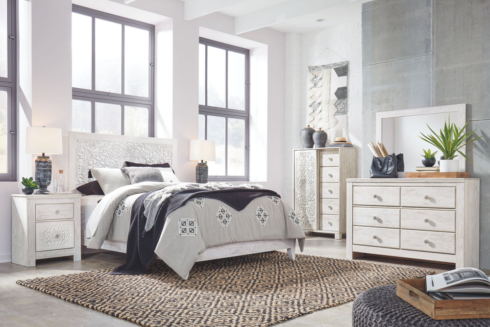 Your young trendsetter can live out her free spirit with this uniquely chic queen bed. Exquisite carved medallion pattern is a testament to true style. Charming whitewashed finish sets a foundation for a room bursting with personality. Headboard legs have