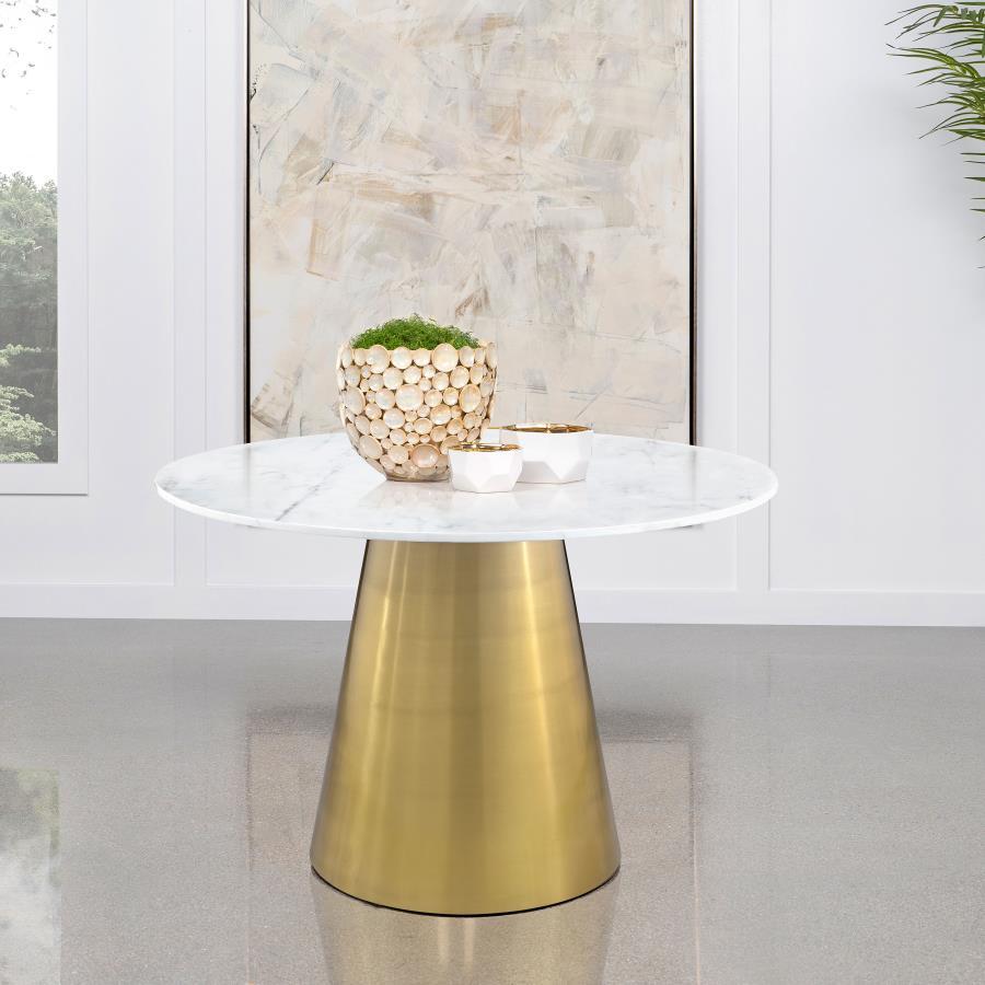 Freshen up your elegant dining room with the luxurious look and feel of genuine marble. This modern dining table pairs a round silhouette with beautiful white marble complete with light grey veining that offers organic elegance and dimensionality. This st
