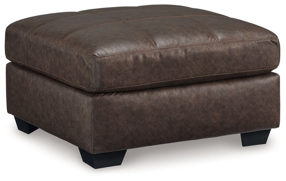 Everyday comfort meets versatile style in this oversized ottoman. The handsome hue of the goes-with-anything faux leather takes away the stress of styling, expertly pairing with your existing aesthetic. From kicking back on the weekends to relaxing post-w