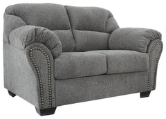 Why sacrifice comfort for style (or style for comfort) when you can have the best of both in this loveseat in pewter gray. Elements include a chic divided-back design and pillow top wrapped armrests that make nodding off all too easy. Calling attention to