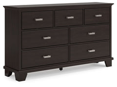 Feast your eyes on this richly versatile dresser. Its traditional-inspired dark brown finish effortlessly blends with contemporary bright nickel-tone pulls to create a stunning look that-'s not too stuffy or too trendy. Spacious drawers offer plenty of st