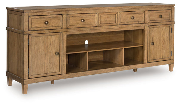 Taking a timeless approach to casual beauty, this TV stand brings easygoing elegance to the everyday. The light brown wood-tone finish seamlessly slips into your roomâ€™s aesthetic. Two spacious cabinets (each with an adjustable shelf), four drawers and a
