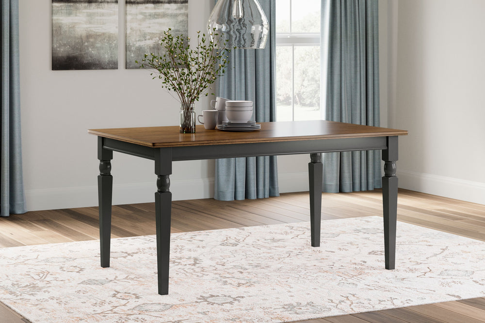The farmhouse table is more in style than everâ€”and doesnâ€™t this rectangular dining room table bring it back in brilliant fashion. It dons a subtle two-tone finish for a look that-'s equally homey and sophisticated. Vintage inspiration at its best. Sea