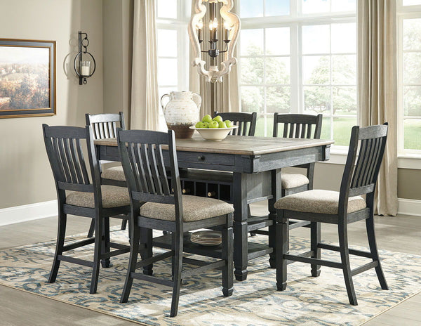 Unique two-tone finish with a combination of Oak and Acacia substrates combining a trendy textured antique black color with table and server tops finished in a textural weathered oak finish. Rectangular dining table features six convenient drawers for sto