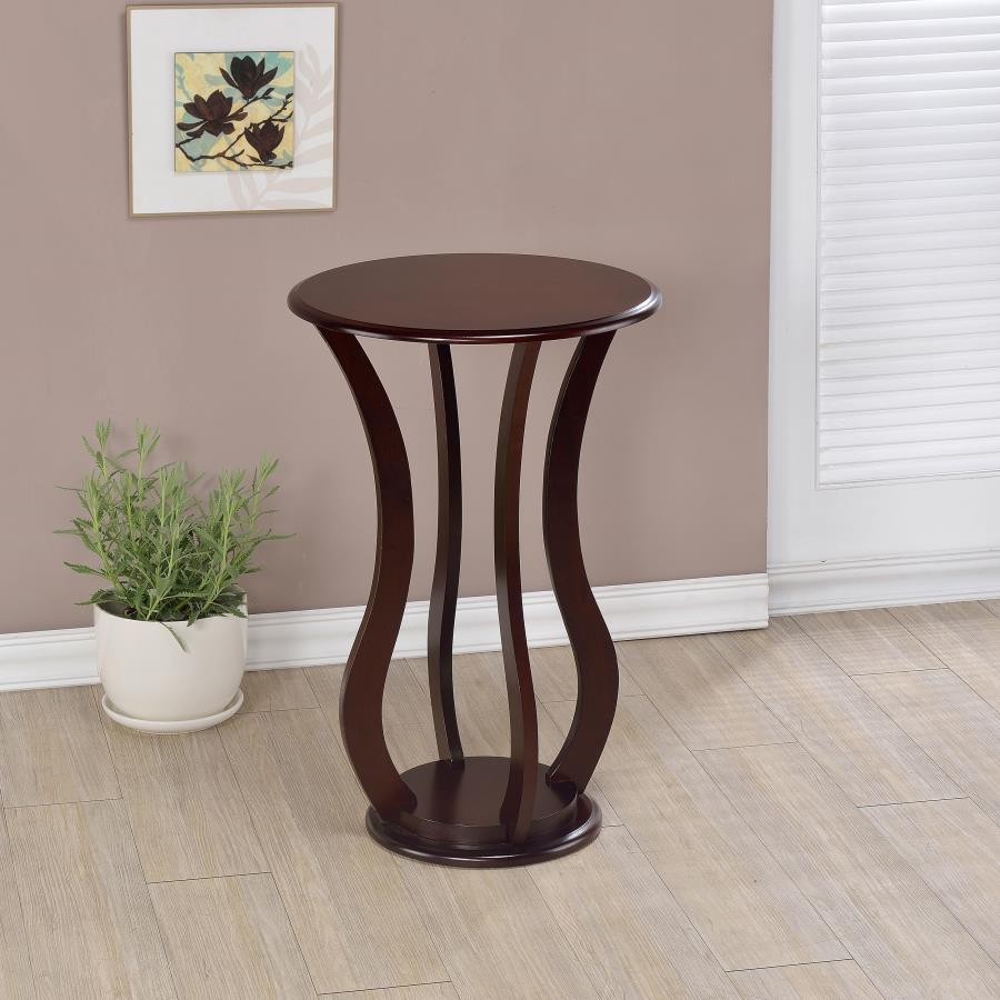 This side table or plant stand boasts an elegant design with smooth, graceful curves, blending hardwood and engineered wood for a sturdy yet stylish construction. The round top, crafted from basswood veneer, is finished in a rich cappuccino shade that bea