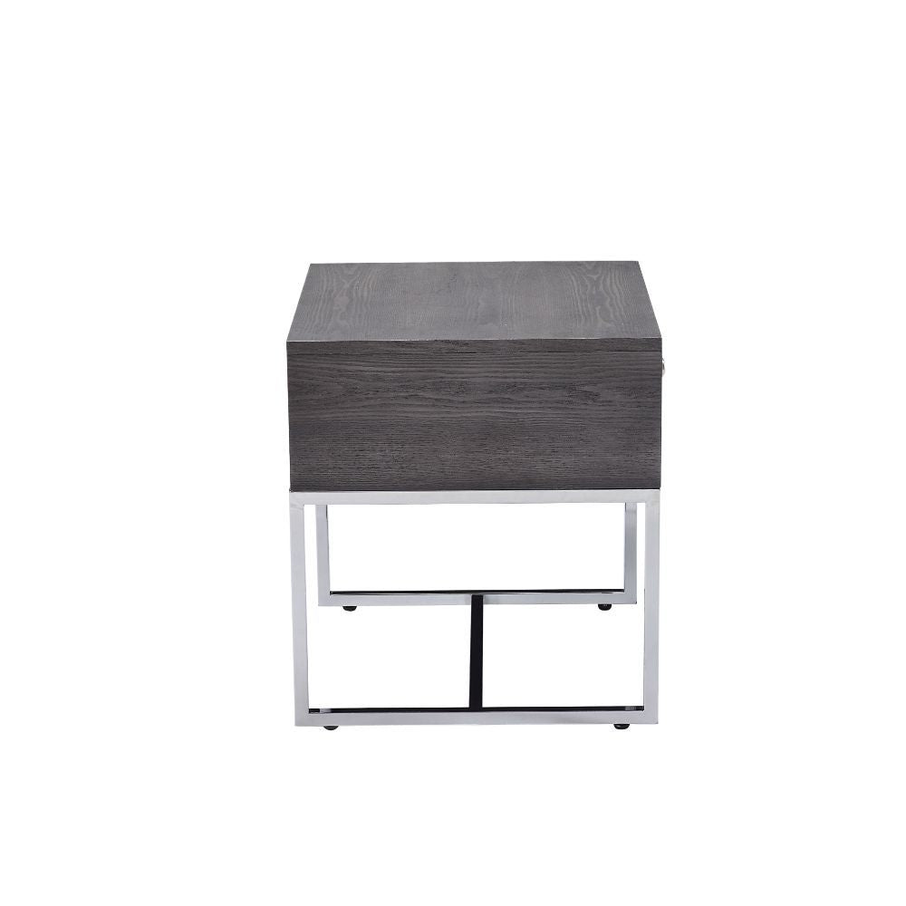 Maximize your living space with the attractive Iban End Table. Designed for with both function and style, this rectangular occasional table features a rich gray oak finish and a sturdy, metal sled base. The minimalist style and neutral color scheme create