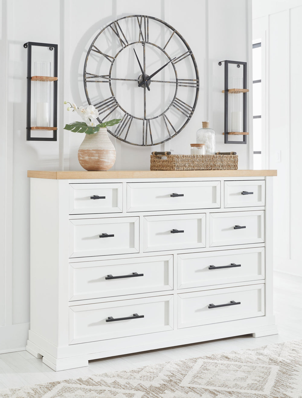 Casual style with substance. This two-tone dresser raises the bar on comfortably cozy design in your soothing sanctuary. A sturdy silhouette with a classic white finish and black metal hardware exudes modern farmhouse vibes. The butcher block oak veneer t