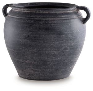 Celebrate the artisanal character of ceramics with this vase. Its distressed black finish has a time-worn, weathered appeal, offering the look of the past with a modern feel. The vase-'s neutral tone makes it a go-to for all seasons, allowing you to stage