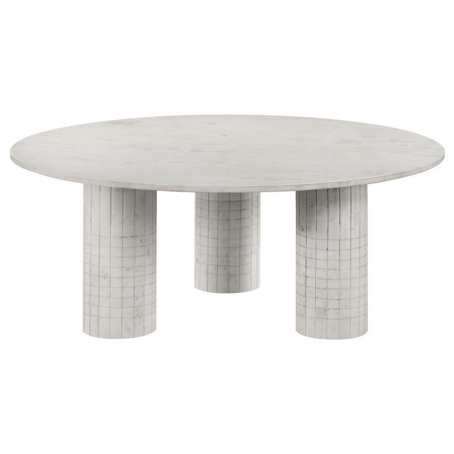 Amidst the gentle hum of daily life, this coffee table, crafted from genuine white marble, commands attention with its avant-garde design. Its round top rests on three cylindrical pedestals, each adorned with subtle grid-textured detailing. Blending the t