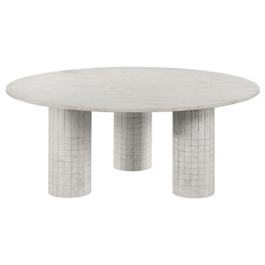 Amidst the gentle hum of daily life, this coffee table, crafted from genuine white marble, commands attention with its avant-garde design. Its round top rests on three cylindrical pedestals, each adorned with subtle grid-textured detailing. Blending the t