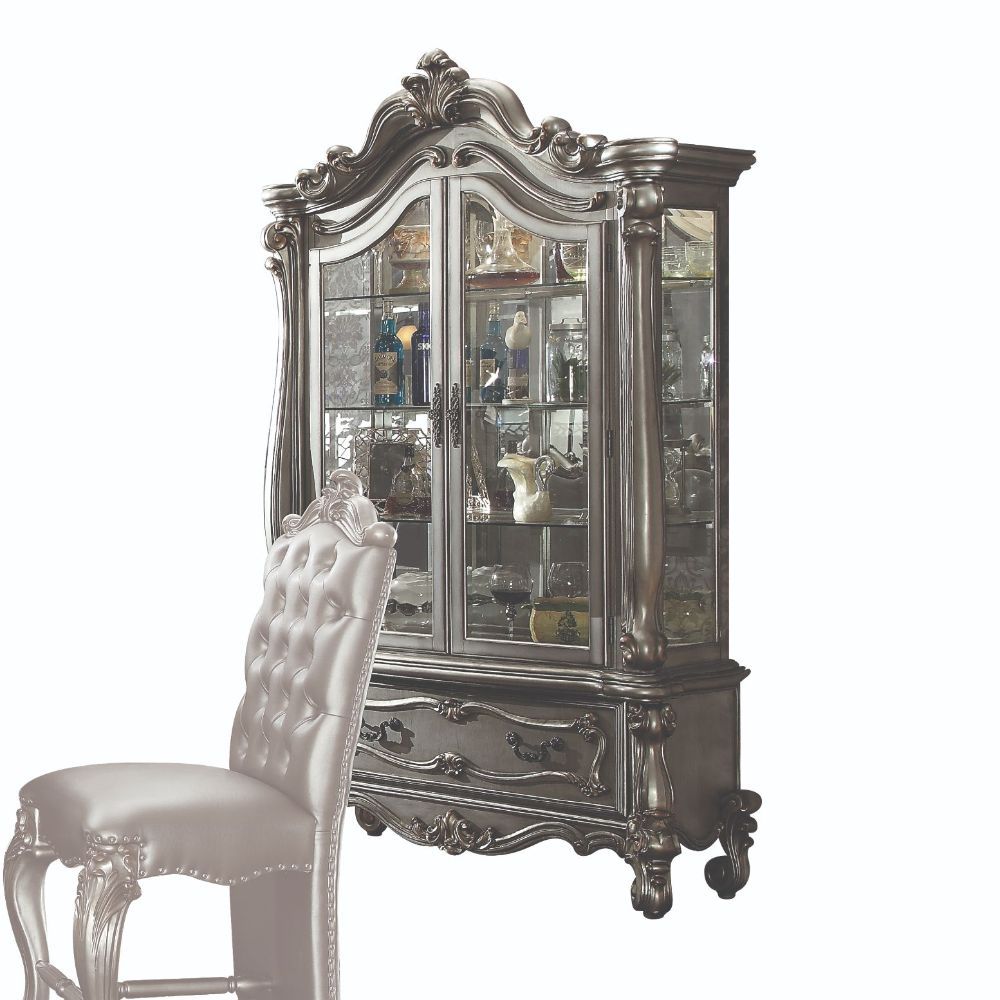 Curio Cabinet Arched Top: Touch Light & 2 Glass Doors (3 Glass Shelves & Back Mirror Inside) Base: 1 Drw Oversized Scrolled Trim, Leaf Crown and Post-Leg (Poly Resin with Antique Contrast Finish) Drawer: GLIDE Side Metal, Dovetail French, Felt-Lined Inclu