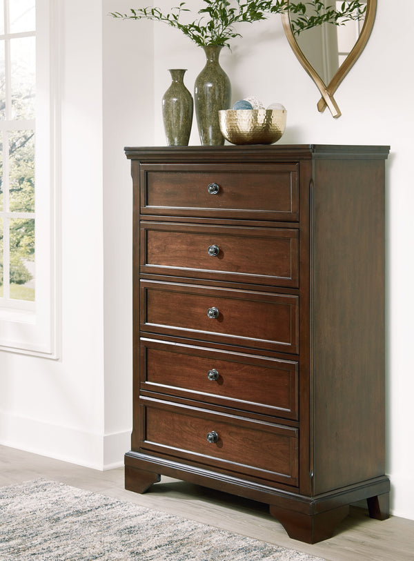  while its functionalism is equally impressive. There is lots of room for clothes and other essentials in five drawers with a warm brown cherry fin