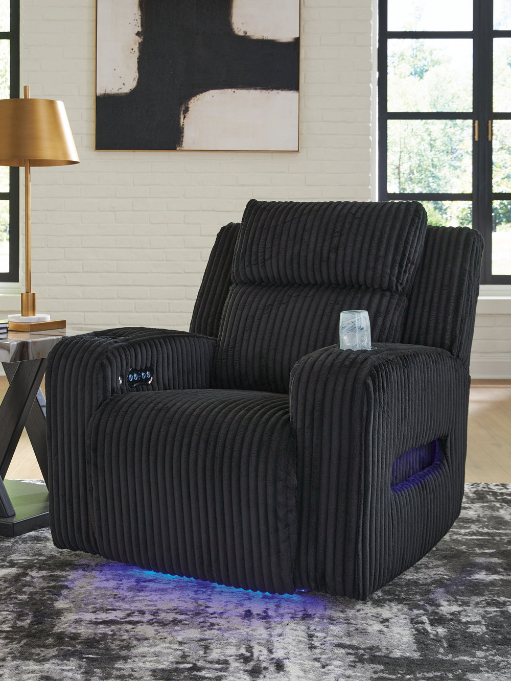 Trend-right style, meet irresistible modern function. Your living room gets a cozy-cool upgrade with this power recliner. Curl up in its ultra-chic corded upholstery and recline with one-touch controls. Is it movie night or game time? With ambient LED lig