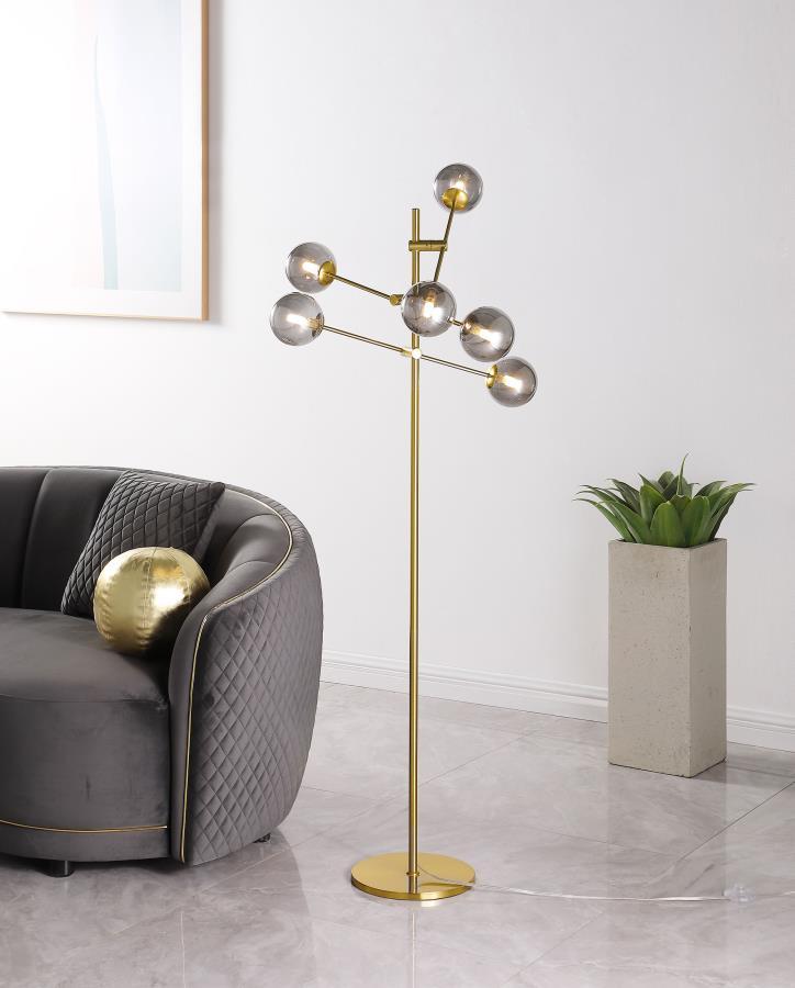 Accentuate an inviting space with the vintage flair of this modern six-light floor lamp. Its silhouette is Sputnik inspired, with glass orb shades on crossing stems, creating an orbital effect that-'s sure to capture attention. The lamp features a strict 
