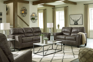 If you love the cool look of leather but long for the warm feel of fabric, you can take comfort in this set. Wrapped in a fabulous faux leather with a weathered hue and hint of pebbly texture to resemble the real deal, this decidedly modern sofa proves le