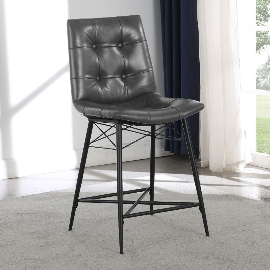 Cool and cozy, this counter height stool is the ultimate dining room upgrade. The padded seat is wrapped in smooth leatherette for an inviting look and feel. Button tufting adds a subtle, decorative touch. A sleek, metal base gives it a modern look while 