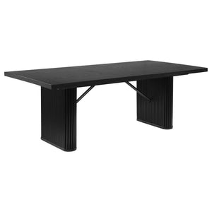 Make a bold statement with this stunning dining table. Its oak veneer top with a sleek black finish exudes elegance and modernity. The tambour base design steals the show with its captivating fluted patterns, showcased on the double pedestal legs. Embrace