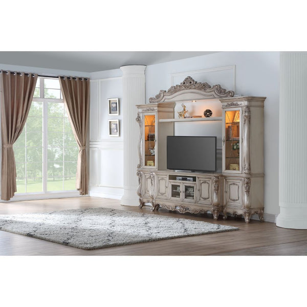 Exclusively designed and filled with romantic spirit, the beautiful Gorsedd entertainment center features Queen Anne legs and carved apron and trim, decorated with raised and oversized scrolled moldings in an antique champagne finish. This sophisticated l