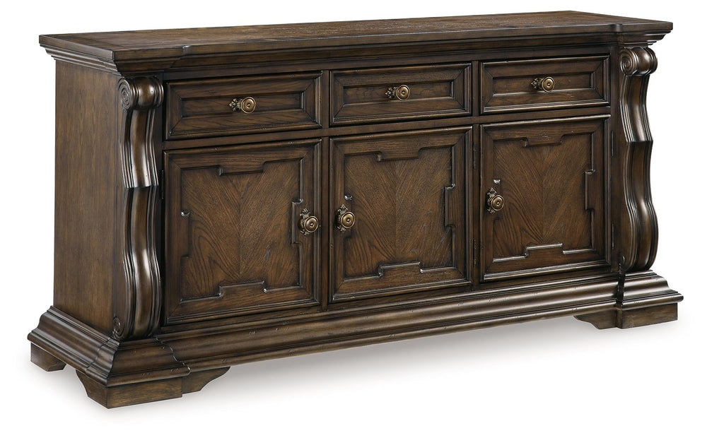 From its ornamental appliques to its large scale, this dining buffet makes a bold statement. With multiple cabinets and drawers to store necessities, the opulent piece wows with stunning style. The look is timeless. The feel? Right at home.<br><br><b>Addi