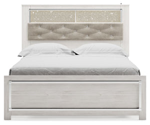  a pearlized finish and button-tufted upholstery bring a glam touch to the richly rustic appearance. Rem