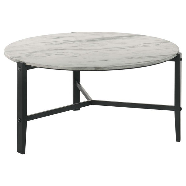 Create a minimal aesthetic in your living room with this modern coffee table. Slim black solid rubberwood legs form a stand-like base that supports a spacious round top. The high-pressure laminate top features a faux white marble design with textured stri