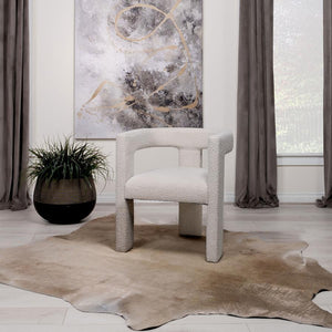  this chair redefines the art of relaxation with its all-fabric design. The seamless transition from the cushioned seat to the curved arms