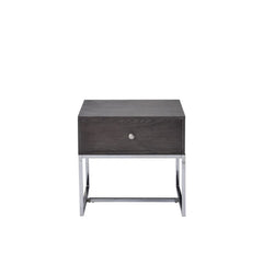 Maximize your living space with the attractive Iban End Table. Designed for with both function and style, this rectangular occasional table features a rich gray oak finish and a sturdy, metal sled base. The minimalist style and neutral color scheme create