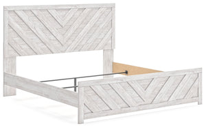  this king panel bed embraces the aesthetics of countryside living and repurposes them for modern settings. Its whitewash paint
