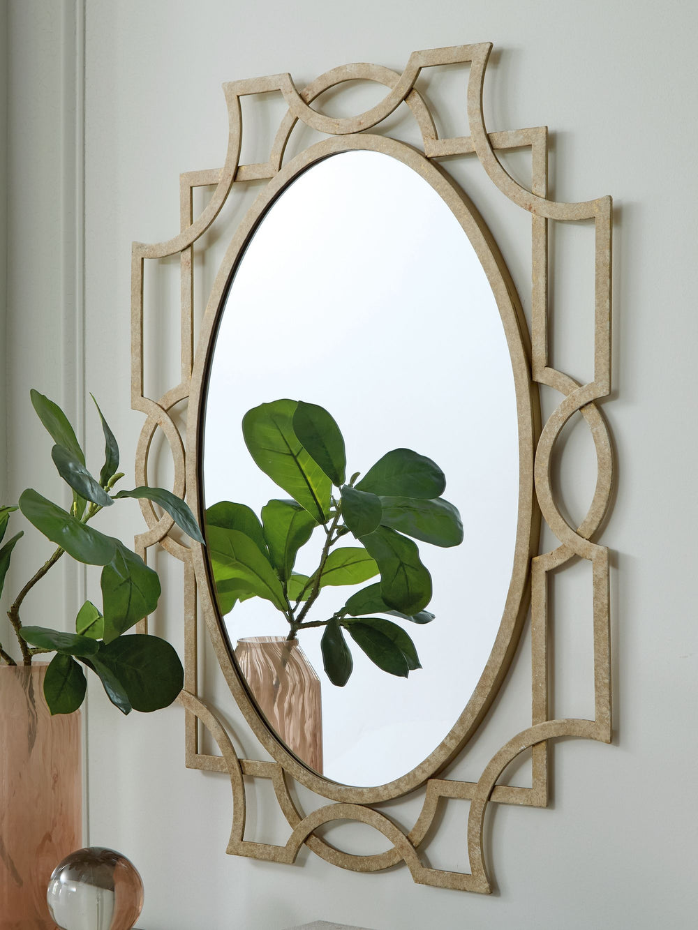 Reflect your love of casual elegance. With its antiqued goldtone finish and intricate metal frame, this accent mirror creates a relaxed yet refined sensibility. Hang it above a fireplace, vanity or entryway table to create a stunning focal point that adds