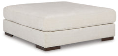 Relax in style on this oversized ottoman. With a look and feel inspired by fine menswear, the spacious piece has rich textures that are easy on the eyes and a pleasure to touch. Its soft, neutral hue and smart tailoring look right at home in any decor.<br