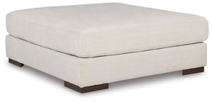 Relax in style on this oversized ottoman. With a look and feel inspired by fine menswear, the spacious piece has rich textures that are easy on the eyes and a pleasure to touch. Its soft, neutral hue and smart tailoring look right at home in any decor.<br