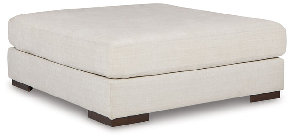 Relax in style on this oversized ottoman. With a look and feel inspired by fine menswear, the spacious piece has rich textures that are easy on the eyes and a pleasure to touch. Its soft, neutral hue and smart tailoring look right at home in any decor.<br