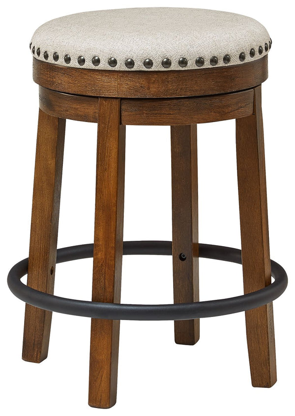 A touch of rustic-industrial style is such a fashion-forward choice, and this swivel stool doesnâ€™t disappoint. Its smooth swivel motion adds function, while nailhead trim brings effortless style. A softly upholstered cushion seat in beige keeps things c