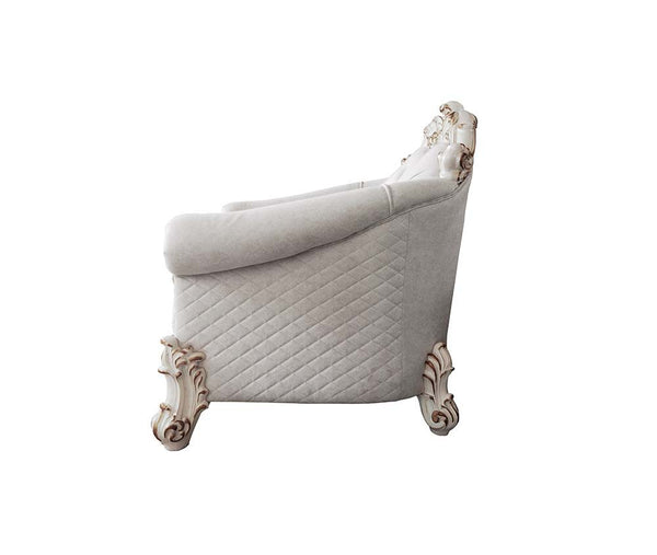 our new interpretation of Vendome II is donned. The Vendome II sofa-'s light gray fabric is grand and classy with crystal like button tufting on the back in a crackled gold p
