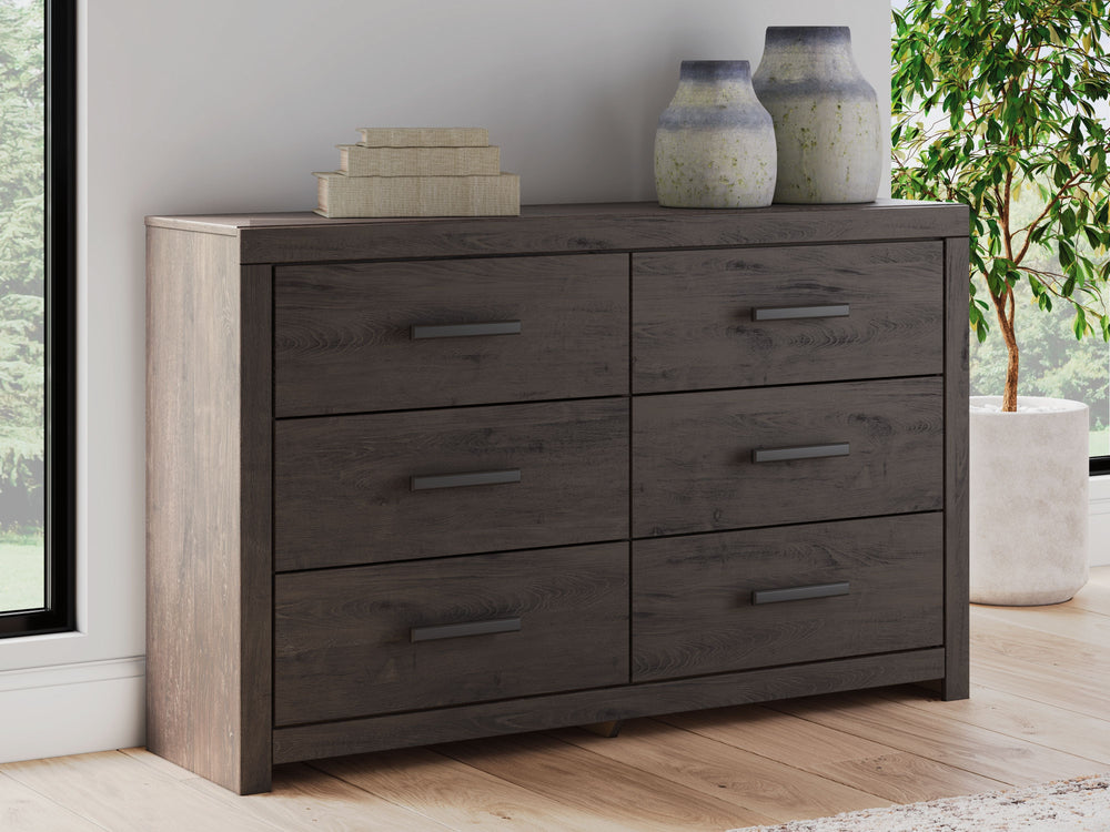 Designed with everyday style in mind, this dresser is a simply chic approach to modern living. A dark charcoal finish blends black and brown undertones, creating a versatile look that effortlessly pairs with your existing pieces. And for must-have functio