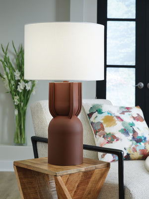  this table lamp illuminates your home in luxe style. It reflects your contemporary eye for design with a brick red finish and artisanal silhouette. What a refined addition to your living room or office.<br><br><b>Additional Dimen
