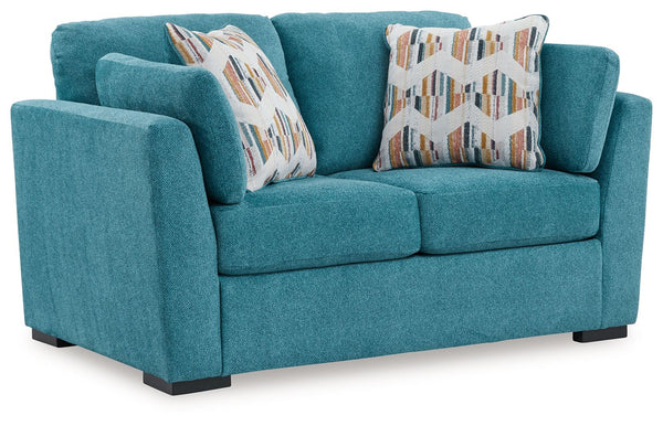You want your home to reflect your modern, trendy eye for design. This loveseat is here to help. Bold, bright and beautiful, it adds a fashion-forward pop of color to your living room. Velvet-like upholstery and matching bolster pillows keep comfort at to