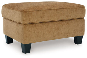 Thereâ€™s something about this ottoman thatâ€™s so easy to appreciate. Maybe itâ€™s the plush upholstery and comforting earthy tone, eager to support your quest for total relaxation. Perhaps it-'s the modern flair of its simple lines and tapered accent le